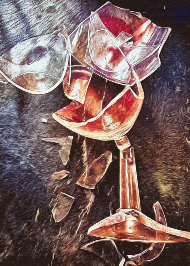 A broken wine glass with sunlight streaming through, symbolising breaking free from addiction. Sobriety vs. Recovery: The Truth About Healing and Moving Forward