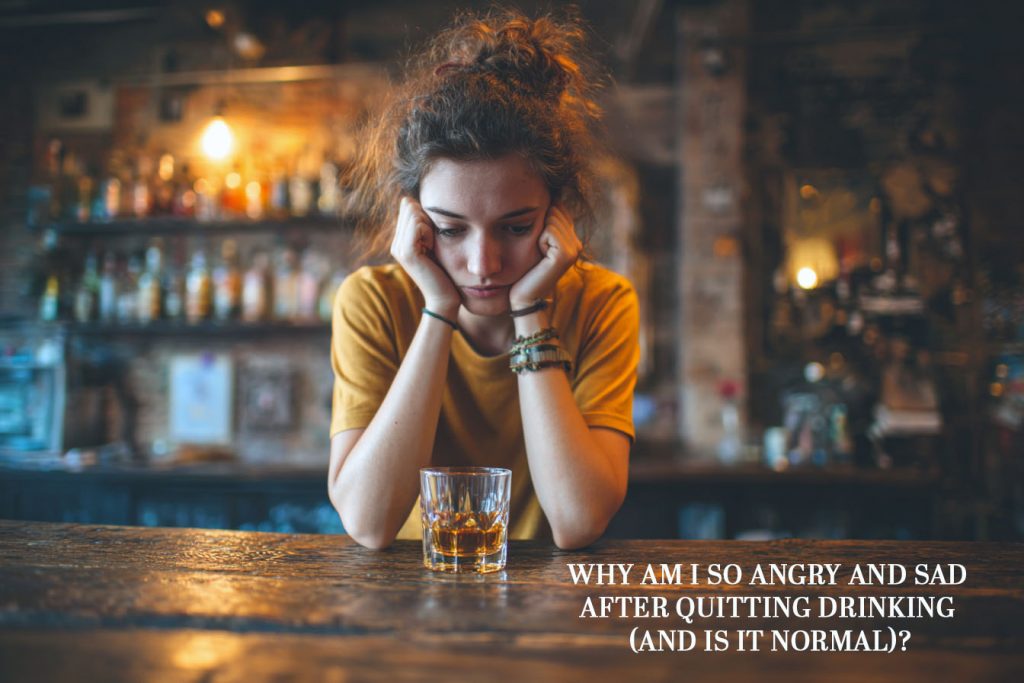 female looking sad and forlorn at a table with a half glass of spirits.  Why Am I So Angry and Sad After Quitting Drinking (And Is It Normal)?